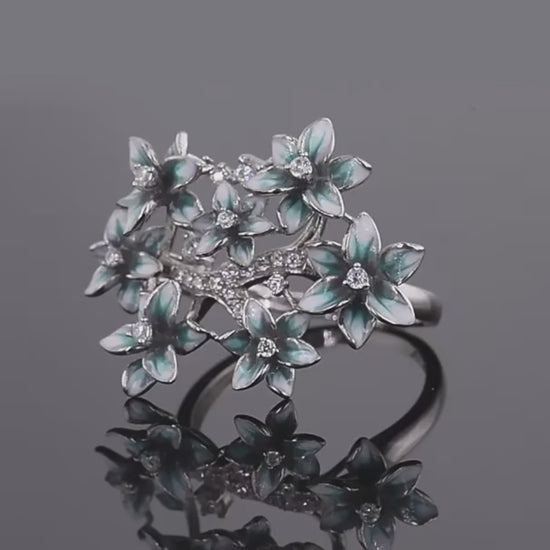 Silver ring with blue and white enamel hydrangea flowers and sparkling stones

