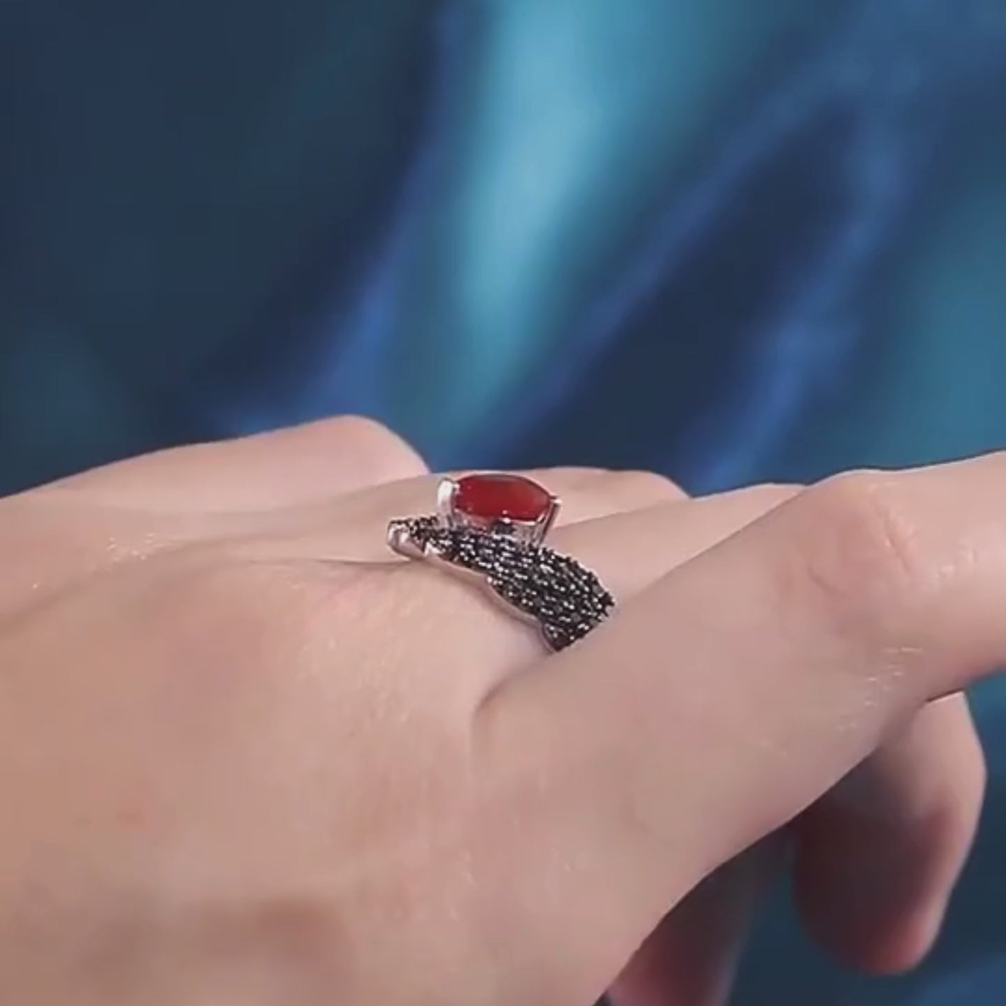 Sterling silver ring with a heart-shaped black gemstone flanked by pavé-set wing-like details, from the Ali Nere design.

