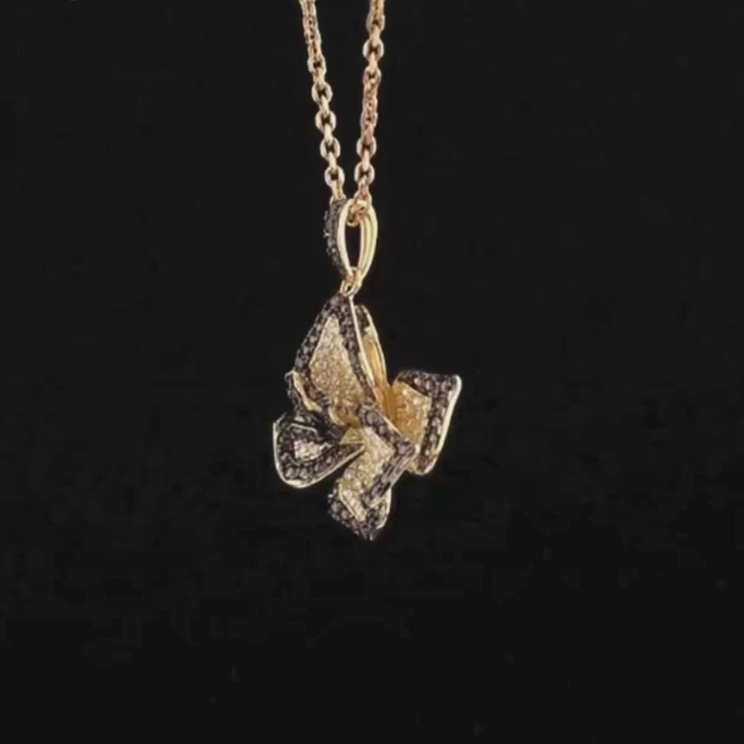Pendant shaped like a layered flower with brown and white pavé stones on gold-toned metal

