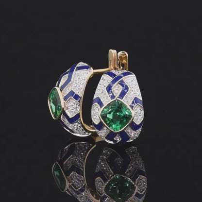 Gold and silver oval earrings with green cushion-cut stones, navy enamel, and geometric patterns

