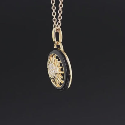 Gold and black circular sun pendant with clear stones at the center, titled Solis Oro.

