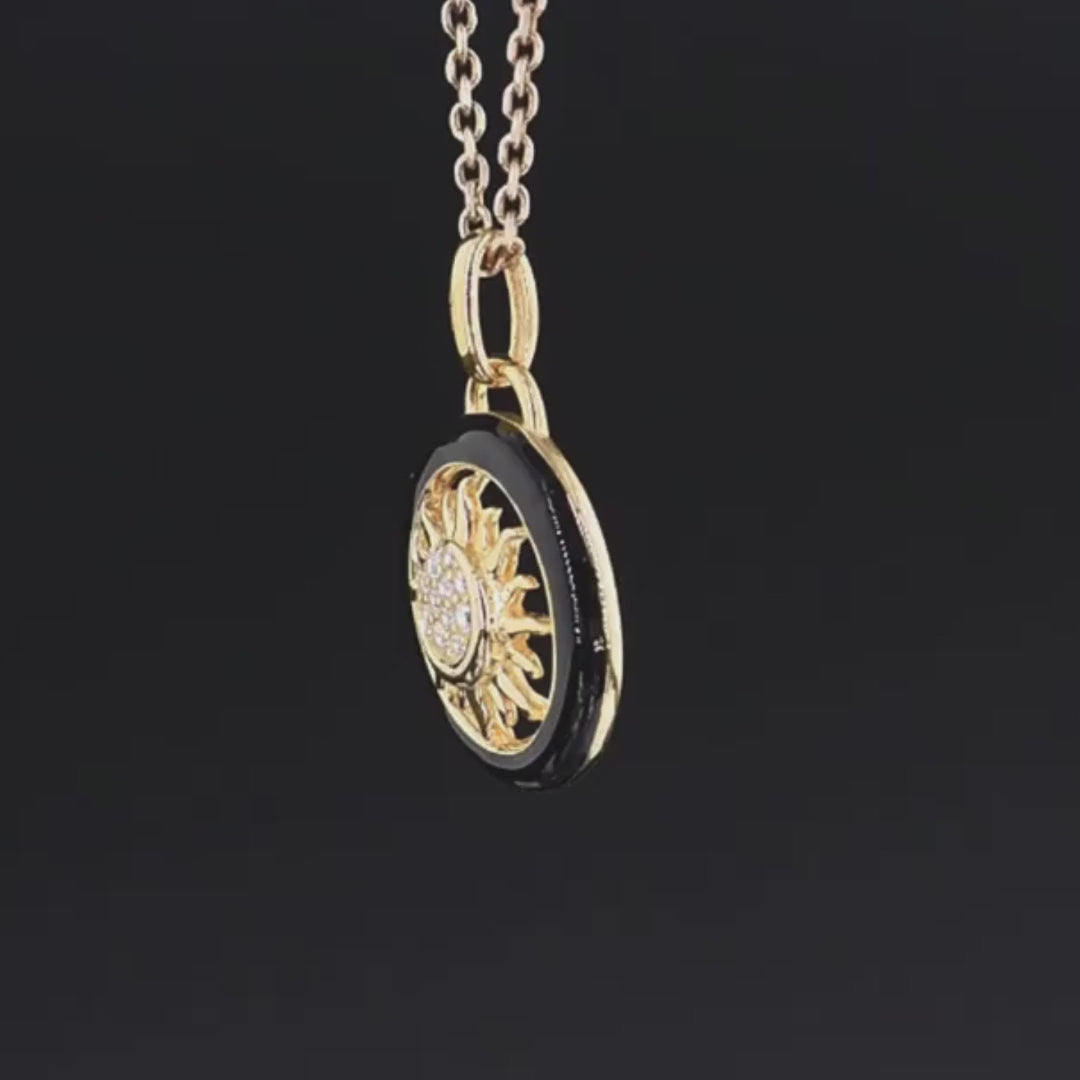 Gold and black circular sun pendant with clear stones at the center, titled Solis Oro.

