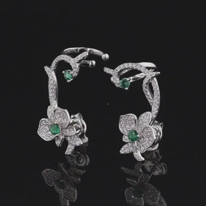 Floral vine-inspired earrings with sparkling white pavé and green gemstone accents

